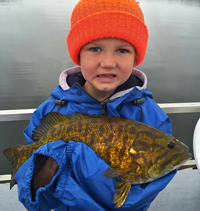 image of Asher Roth with big smallmouth bass