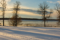 image of bass lake with ice cover along shore