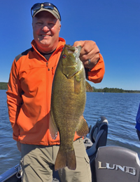 image of fisherman with big Bass