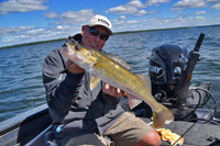 image of fishing guide jeff sundin with big winnie walleye