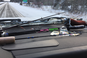 image of fishing rods on dashboard of truck