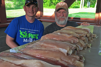 image of Bobby and Dustin Cox with pike fillets