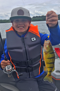 image of Sam Skoglund with giant perch