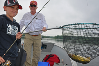 image of gabriel baird with walleye