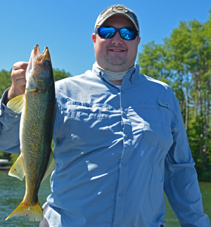 image of angler with walleye