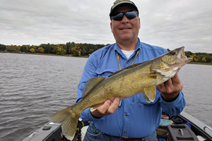 image of Paul Kautza with walleye