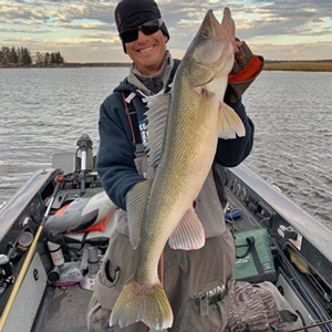 image of angler with big walleye