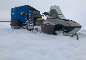 image of snowmobile in deep snow