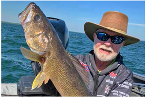 image of greg clusiau with big walleye