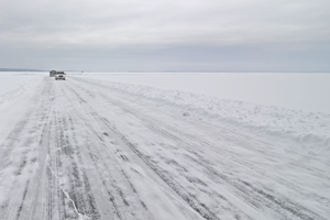 image of ice road on bowstring lake