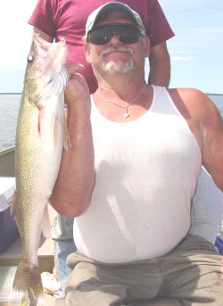 image of angler with big walleye