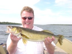 image of fisherman holding walleye